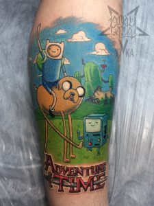 Тату по мотивам мультфильма Adventure Time на ноге