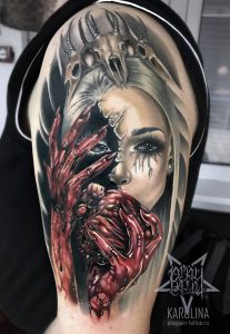 Девушка с сердцем, татуировка в реализме на руке